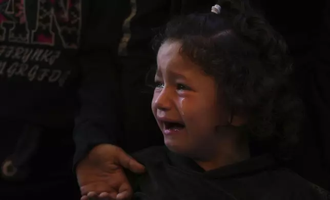 Mira, 4, cries during the funeral of her father, Hosam Wafi who, according to family members, was killed during an Israeli strike, in Khan Younis, southern Gaza Strip, Monday, June 2, 2025. (AP Photo/Abdel Kareem Hana)