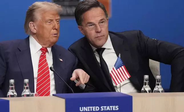 President Donald Trump and NATO Secretary General Mark Rutte attend a plenary session at the NATO summit in The Hague, Netherlands, Wednesday, June 25, 2025. (AP Photo/Matthias Schrader)