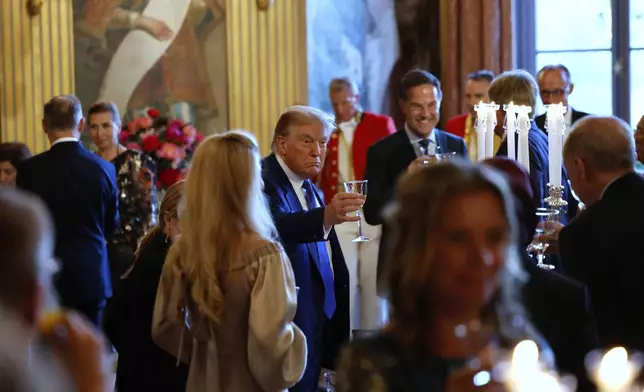 President Donald Trump, center, attends a dinner of NATO heads of state and government at the Paleis Huis ten Bosch ahead of the NATO summit in The Hague, Netherlands, Tuesday, June 24, 2025. (Remko de Waal, Pool Photo via AP)