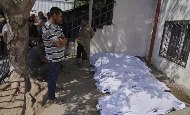 Palestinians mourn their relatives who were killed in an Israeli military strike on Gaza, during their funeral in al-Shifa hospital in Gaza City, Tuesday, June 10, 2025. (AP Photo/Jehad Alshrafi)