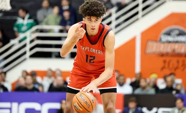 FILE - Christopher Columbus' Cameron Boozer directs teammates during a high school basketball game against Sierra Canyon at the Hoophall Classic, Monday, Jan. 16, 2023, in Springfield, Mass. (AP Photo/Gregory Payan, File0