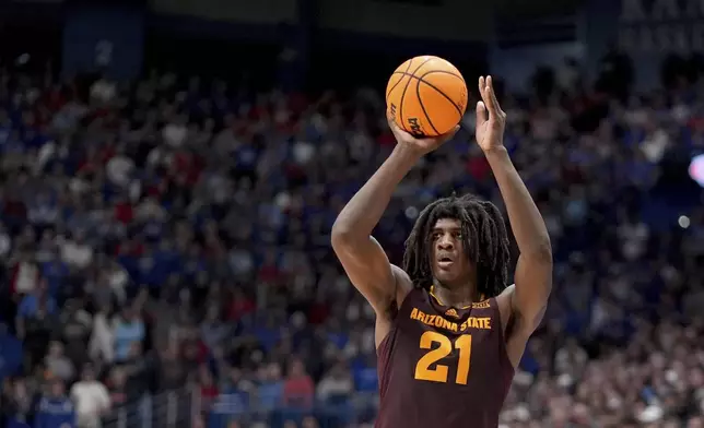 FILE - Arizona State forward Jayden Quaintance shoots during the second half of an NCAA college basketball game against Kansas, Wednesday, Jan. 8, 2025, in Lawrence, Kan. (AP Photo/Charlie Riedel, File)