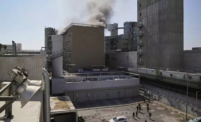Smokes raises from a building of the Soroka hospital complex after it was hit by a missile fired from Iran in Be'er Sheva, Israel, Thursday, June 19, 2025. (AP Photo/Leo Correa)