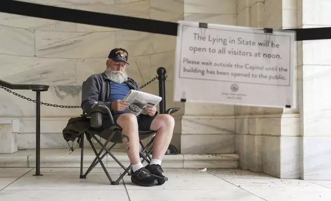 Mike Starr from Oak Grove, Minn. is the first person in line pay his respects to former Minnesota House Speaker Melissa Hortman, who will lie in state with her husband, Mark, and their golden retriever, Gilbert at the Minnesota Capitol rotunda on Friday, June 17, 2025 in St. Paul, Minn. (Alex Kormann/Star Tribune via AP)