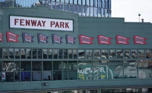 The press box is decorated with championship penants at Fenway Park, Tuesday, June 3, 2025, in Boston. (AP Photo/Robert F. Bukaty)