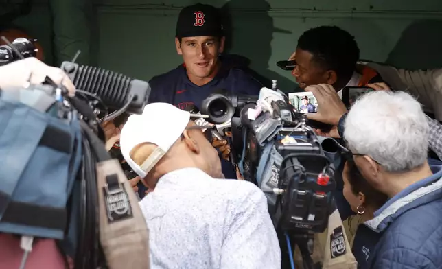Boston Red Sox outfielder Roman Anthony speaks with the media in the dugout before making his first major league start in a baseball game against the Tampa Bay Rays at Fenway Park, Monday, June 9, 2025, in Boston. (AP Photo/Mary Schwalm)