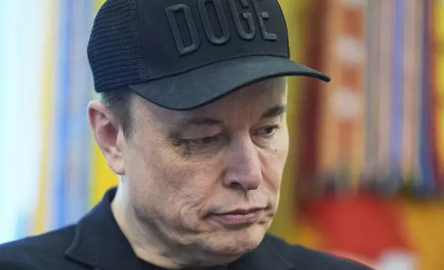 Elon Musk attends news conference with President Donald Trump in the Oval Office of the White House, Friday, May 30, 2025, in Washington. (AP Photo/Evan Vucci)