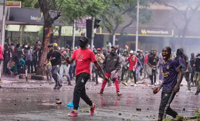 People protest for the one-year anniversary of deadly anti-tax demonstrations in Nairobi, Kenya, Wednesday, June 25, 2025. (AP Photo/Brian Inganga)