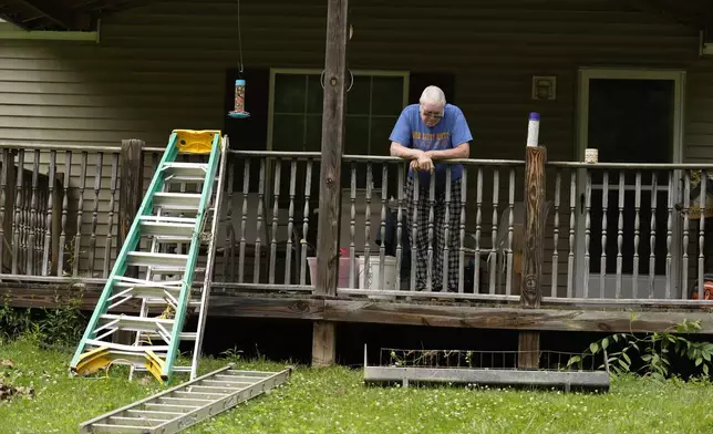AR Walker stands at his flood-damaged home along the little Wheeling creek, Monday, June 16, 2025, outside Wheeling, W.Va. (AP Photo/Carolyn Kaster)