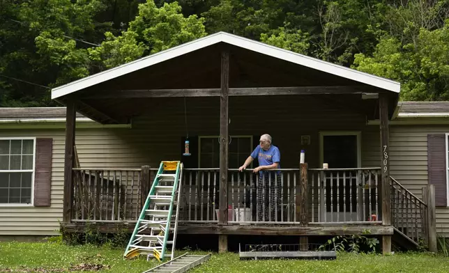 AR Walker stands at his flood-damaged home along the little Wheeling creek, Monday, June 16, 2025, outside Wheeling, W.Va. (AP Photo/Carolyn Kaster)