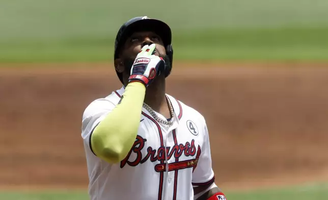 Atlanta Braves designated hitter Marcell Ozuna reacts after hitting a home run during the first inning of a baseball game against the Boston Red Sox, Sunday, June 1, 2025, in Atlanta. (AP Photo/Butch Dill)
