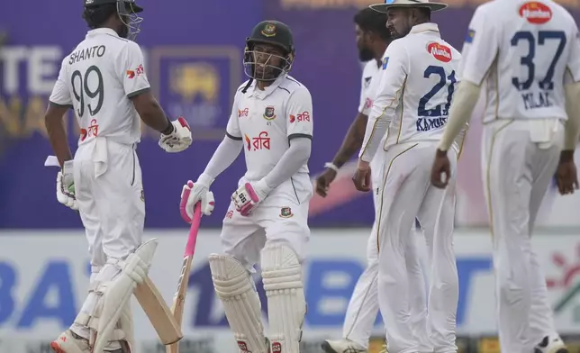 Bangladesh's Mushfiqur Rahim, second left, reacts after being dismissed during the fifth day of the first cricket test match between Sri Lanka and Bangladesh in Galle, Sri Lanka, Saturday, June 21, 2025. (AP Photo/Eranga Jayawardena)