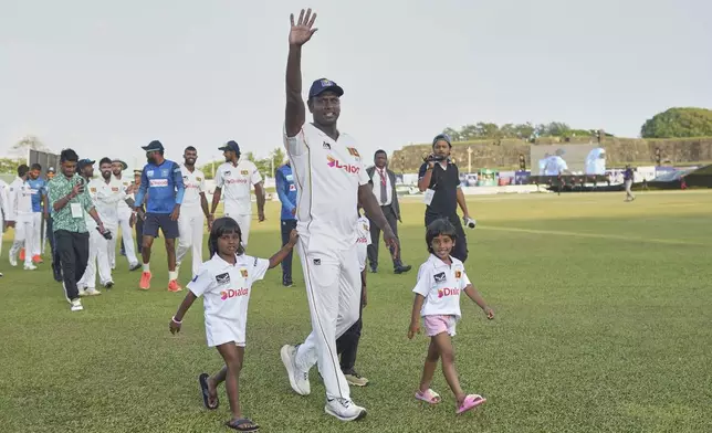 Sri Lanka's Angelo Mathews who played his career last test cricket match waves to supporters at the end of the first cricket test match between Sri Lanka and Bangladesh in Galle, Sri Lanka, Saturday, June 21, 2025. (AP Photo/Eranga Jayawardena)