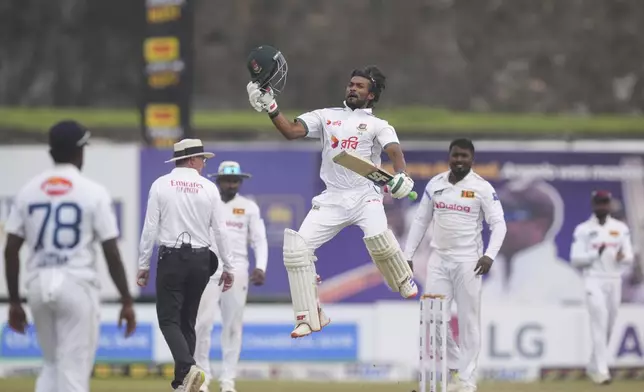 Bangladesh's captain Najmul Hossain Shanto celebrates his century during the fifth day of the first cricket test match between Sri Lanka and Bangladesh in Galle, Sri Lanka, Saturday, June 21, 2025. (AP Photo/Eranga Jayawardena)