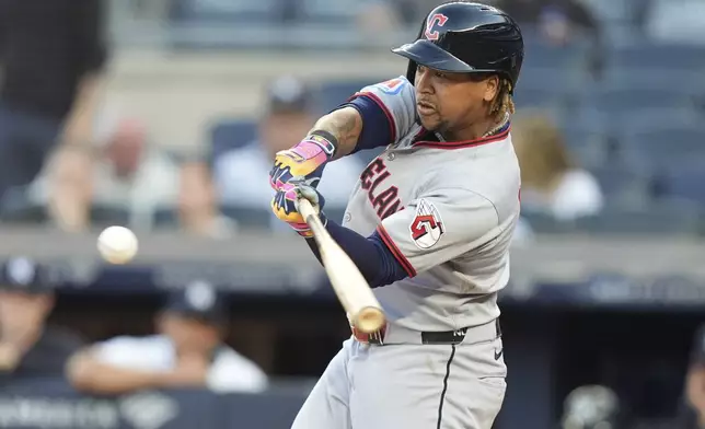 Cleveland Guardians' José Ramírez hits a double during the first inning of a baseball game against the New York Yankees, Wednesday, June 4, 2025, in New York. (AP Photo/Frank Franklin II)