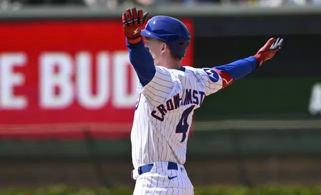 Chicago Cubs' Pete Crow-Armstrong reacts after reaching second base on a fielding error by Cincinnati Reds outfielder Will Benson during the seventh inning of a baseball game, Sunday, June 1, 2025, in Chicago. (AP Photo/Matt Marton)