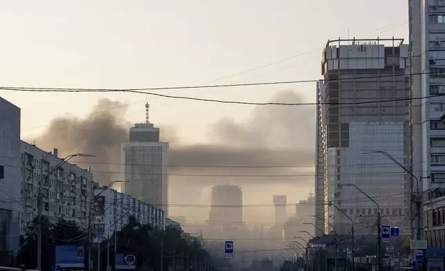 Smoke rising after Russian missile attack, which injured at least 15 people at Kyiv, Ukraine, on Tuesday, June 17, 2025. (AP Photo/Alex Babenko)