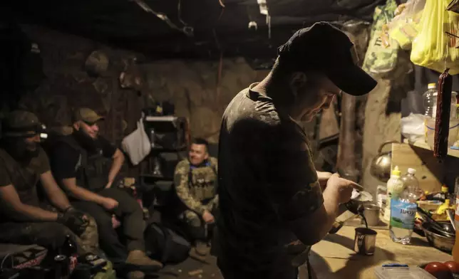 In this photo taken on June 14, 2025 and provided by Ukraine's 24th Mechanized Brigade press service, soldiers have a rest in a shelter on the front line near Chasiv Yar, Donetsk region, Ukraine, Saturday, June 14, 2025. (Oleg Petrasiuk/Ukraine's 24th Mechanized Brigade via AP)