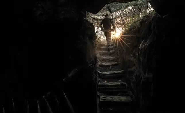 In this photo taken on June 14, 2025 and provided by Ukraine's 24th Mechanized Brigade press service, a serviceman prepares to fire a 155mm M109 howitzer towards Russian army positions near Chasiv Yar, Donetsk region, Ukraine, Saturday, June 14, 2025. (Oleg Petrasiuk/Ukraine's 24th Mechanized Brigade via AP)