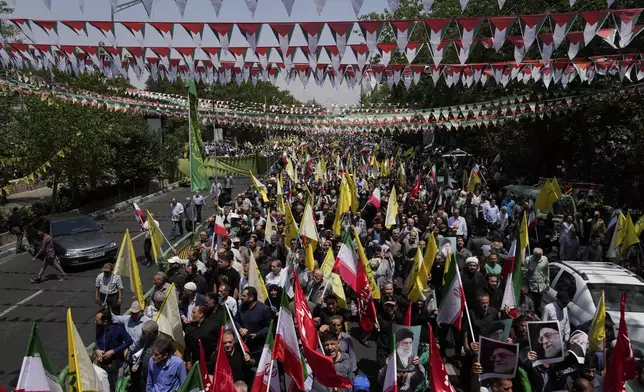 Iranian worshippers attend an anti-Israeli rally after their Friday prayers in Tehran, Iran, Friday, June 13, 2025. (AP Photo/Vahid Salemi)