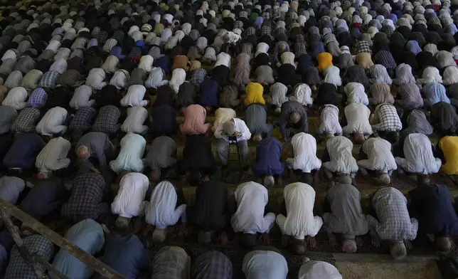 Iranian worshippers perform Friday prayers at Tehran University campus in Tehran, Iran, Friday, June 13, 2025. (AP Photo/Vahid Salemi)