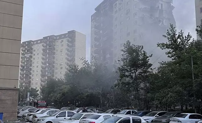 Smoke rises from a damaged building in Tehran, Iran, early Friday, June 13, 2025. Israel attacked Iran's capital early Friday, with explosions booming across Tehran. (AP Photo)