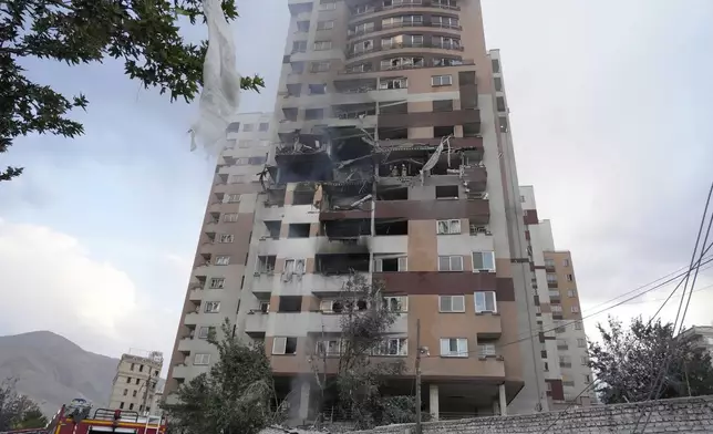 Damages are seen in a building after an explosion in a residence compound after Israel attacked Iran's capital Tehran, Friday, June 13, 2025. (AP Photo/Vahid Salemi)