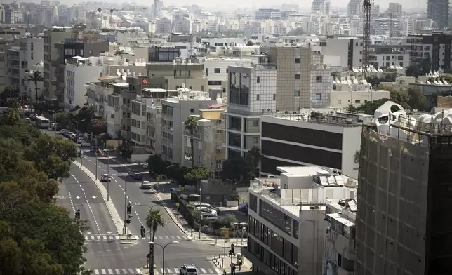 A general view shows the mostly empty streets near Tel Aviv's beachfront, Friday, June 13, 2025. (AP Photo/Leo Correa)
