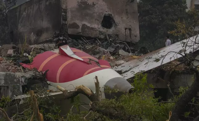 Parts of an Air India plane that crashed on Thursday are seen on top of a building in Ahmedabad, India, Friday, June 13, 2025. (AP Photo/Rafiq Maqbool)