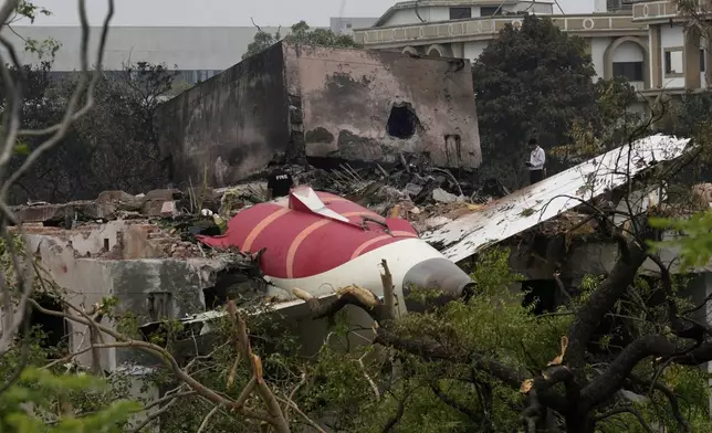 Parts of an Air India plane that crashed on Thursday are seen on top of a building in Ahmedabad, India, Friday, June 13, 2025. (AP Photo/Rafiq Maqbool)