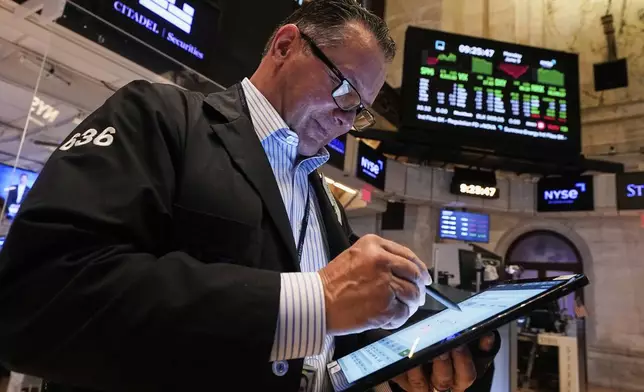 Trader Edward Curran works on the floor of the New York Stock Exchange, Monday, June 9, 2025. (AP Photo/Richard Drew)