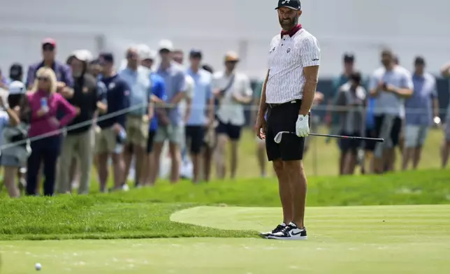 Dustin Johnson watches his ball on the 12th hole during a practice round ahead of the U.S. Open golf tournament at Oakmont Country Club Tuesday, June 10, 2025, in Oakmont, Pa. (AP Photo/Charlie Riedel)