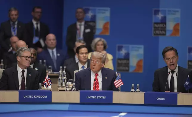United States President Donald Trump, centre, with Britain's Prime Minister Keir Starmer, left listen to Nato General Secretary Mark Rutte during a North Atlantic Council plenary meeting during the the NATO summit in The Hague, Netherlands, Wednesday, June 25, 2025. (AP Photo Kin Cheung, Pool)