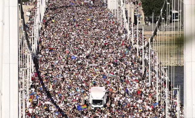 Participants in the Pride march cross the Elisabeth Bridge in Budapest, Hungary, Saturday, June 28, 2025. (AP Photo/Rudolf Karancsi)