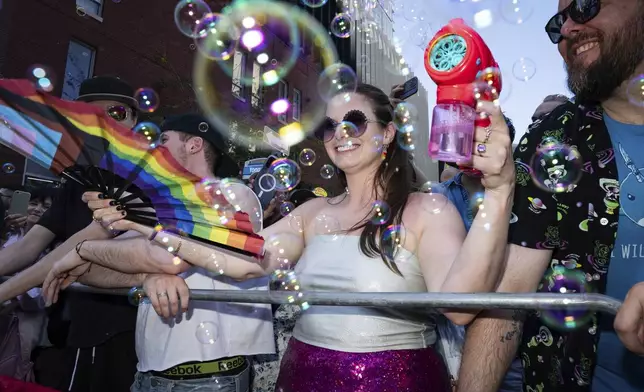 Revelers participate in the Pride Parade on Sunday, June 29, 2025, in Toronto, Canada. (Arlyn McAdorey/The Canadian Press via AP)