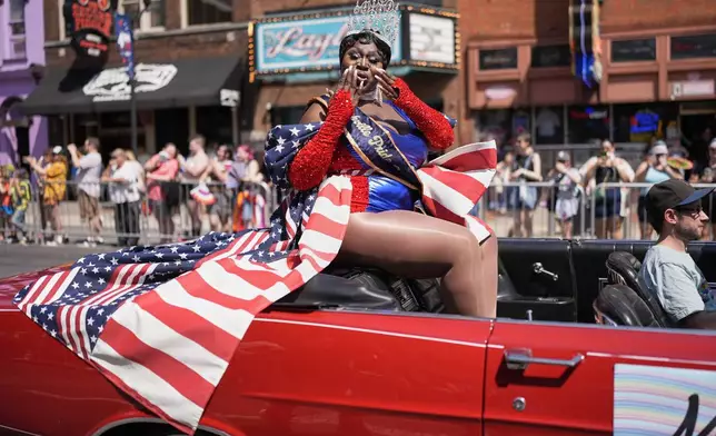 Denise "Nece Sexton" Sadler blows kisses to the crowd during the Nashville Pride Parade, Saturday, June 28, 2025, in Nashville, Tenn. (AP Photo/George Walker IV)