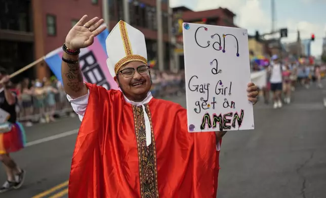 Colby James waves to the crowd during the Nashville Pride Parade, Saturday, June 28, 2025, in Nashville, Tenn. (AP Photo/George Walker IV)