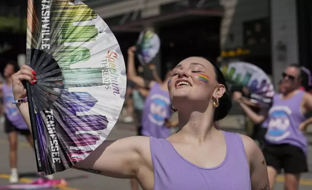 Kerra Blackwell performs as she marches in the Nashville Pride Parade, Saturday, June 28, 2025, in Nashville, Tenn. (AP Photo/George Walker IV)