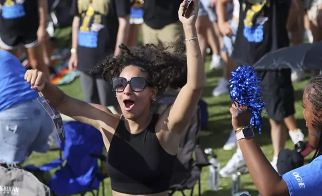 A fan cheers during a celebration of the Oklahoma City Thunder's NBA basketball championship Tuesday, June 24, 2025, in Oklahoma City. (AP Photo/Nate Billings)