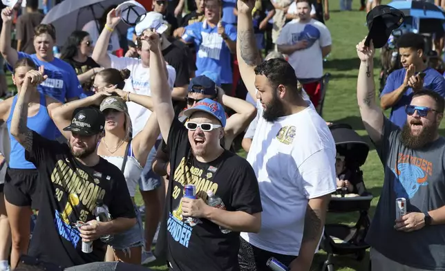 Fans cheers during a celebration of the Oklahoma City Thunder's NBA basketball championship Tuesday, June 24, 2025, in Oklahoma City. (AP Photo/Nate Billings)
