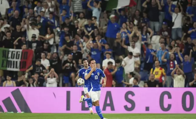 Italy's Giacomo Raspadori celebrates scoring during the World Cup 2026 qualifiers soccer match between Italy and Moldova at the Mapei Stadium, Reggio Emilia, Italy, Monday June 9, 2025. (Massimo Paolone/LaPresse via AP)
