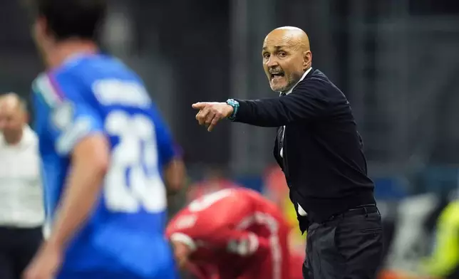 Italy's coach Luciano Spalletti gestures on the sidelines during the World Cup 2026 qualifiers soccer match between Italy and Moldova at the Mapei Stadium, Reggio Emilia, Italy, Monday June 9, 2025. (Massimo Paolone/LaPresse via AP)