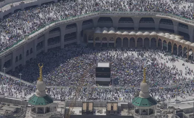 FILE - FILE - Muslim pilgrims circumambulate the Kaaba, the cubic building at the Grand Mosque, during the annual Hajj pilgrimage in Mecca, Saudi Arabia, Monday, June 17, 2024. (AP Photo/Rafiq Maqbool, File, File)