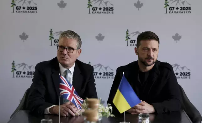 Ukrainian President Volodymyr Zelenskyy, right, and British Prime Minister Keir Starmer attend a bilateral meeting during the G7 Leaders' Summit in Kananaskis, Canada, Tuesday, June 17, 2025. (Suzanne Plunkett/Pool Photo via AP)