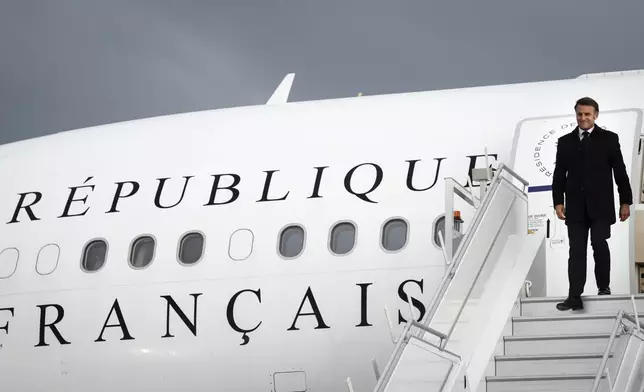 French President Emmanuel Macron arrives in Calgary, Alberta, Sunday, June 15, 2025, to attend the G7 Leaders meeting taking place in the nearby community of Kananaskis. (Jeff McIntosh/The Canadian Press via AP)