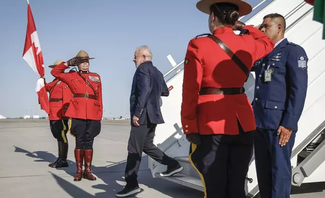 Brazilian President Luiz Inacio Lula da Silva arrives in Calgary, Alberta, Monday, June 16, 2025, to attend the G7 Leaders meeting taking place in Kananaskis, Alberta. (Jeff McIntosh/The Canadian Press via AP)