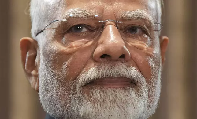 India's Prime Minister Narendra Modi listens before a meeting with Canada's Prime Minister Mark Carney at the G7 Summit in Kananaskis, Alberta, Tuesday, June 17, 2025. (Darryl Dyck/The Canadian Press via AP)