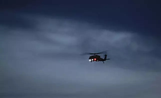 The Marine One helicopter comes into land near Air Force One to leave Calgary, Alta., Monday, June 16, 2025, after attending the G7 Leaders meeting taking place in Kananaskis, Alberta. (Jeff McIntosh/The Canadian Press via AP)