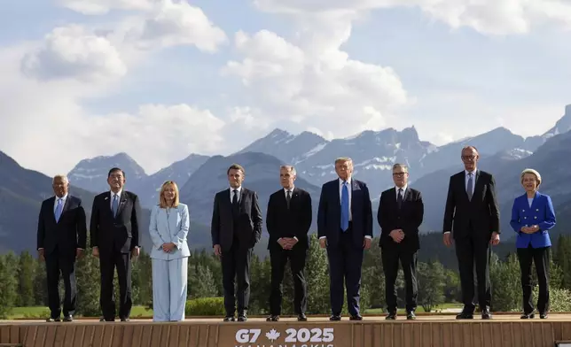 From left, European Council President Antonio Costa, Japan's Prime Minister Shigeru Ishiba, Italy's Prime Minister Giorgia Meloni, France's President Emmanuel Macron, Canada's Prime Minister Mark Carney, President Donald Trump, Britain's Prime Minister Keir Starmer, Germany's Chancellor Friedrich Merz, and European Commission President Ursula von der Leyen pose for a group photo at the G7 Summit, Monday, June 16, 2025, in Kananaskis, Canada. (AP Photo/Mark Schiefelbein)