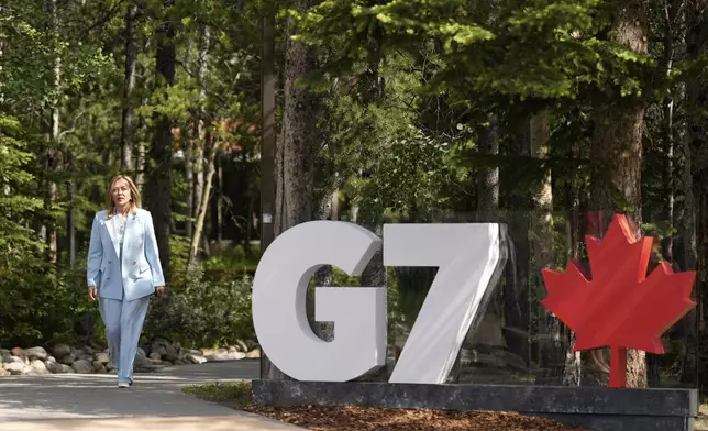 Italy's Prime Minister Giorgia Meloni arrives during the official welcome of the G7 Summit, Monday, June 16, 2025, in Kananaskis, Canada. (AP Photo/Mark Schiefelbein)